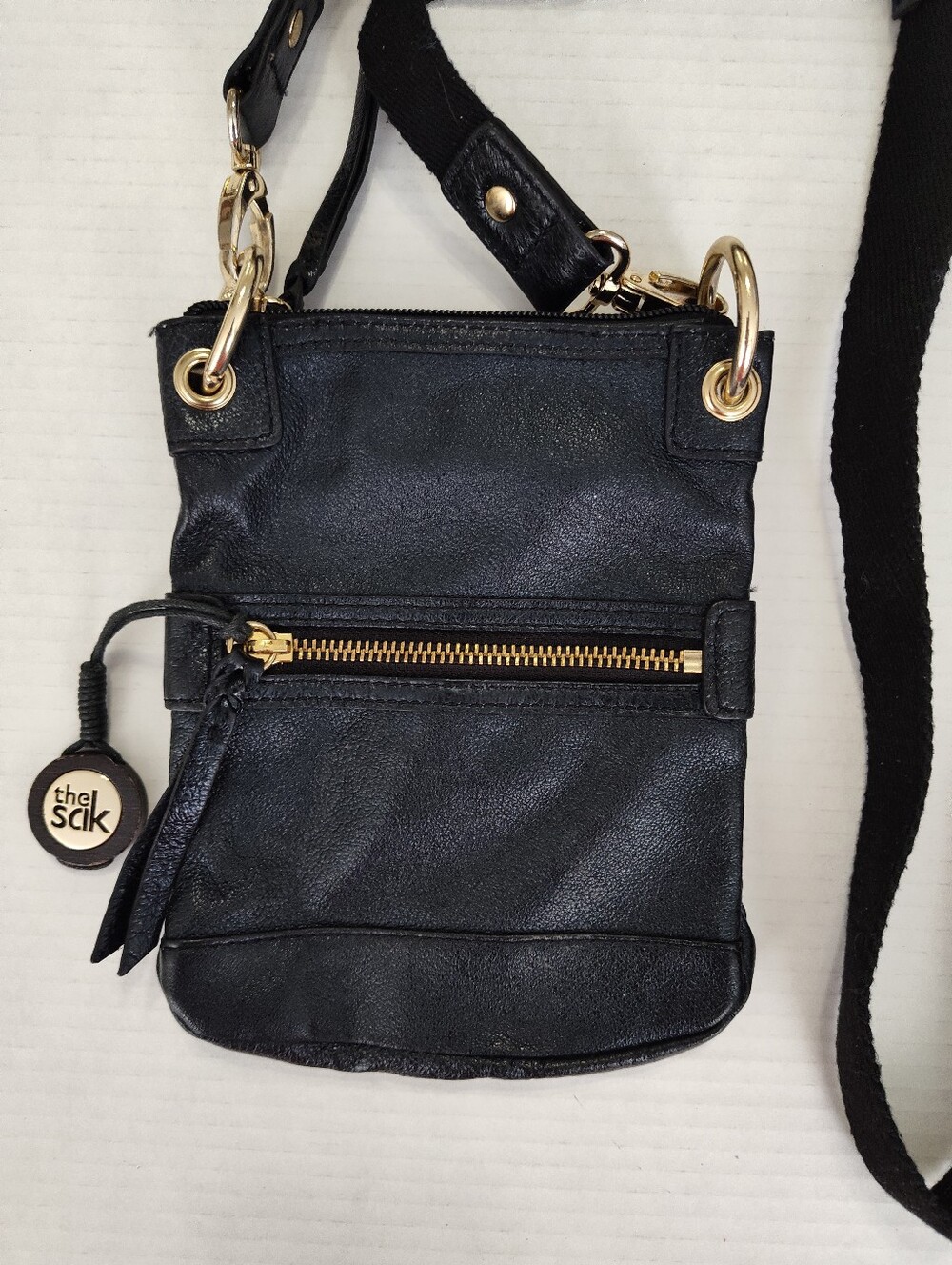 The Sak Black Leather Crossbody with Gold-Tone Hardware Zip Closure